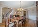 Formal dining room featuring elegant furnishings, hardwood floors, and natural light at 9810 Foxworth Dr, Alpharetta, GA 30022
