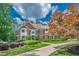 Beautiful brick home with mature trees, lush landscaping, and a curved driveway at 9810 Foxworth Dr, Alpharetta, GA 30022