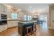 Gourmet kitchen with an island, granite countertops, and stainless steel appliances at 9810 Foxworth Dr, Alpharetta, GA 30022