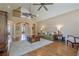 Open living room with vaulted ceiling, stone fireplace, and arched doorways at 9810 Foxworth Dr, Alpharetta, GA 30022
