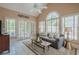 Bright living room area with large windows and tile flooring at 9810 Foxworth Dr, Alpharetta, GA 30022