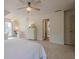 Large primary bedroom featuring a light, neutral color scheme, a desk area, and an ensuite bathroom at 9810 Foxworth Dr, Alpharetta, GA 30022