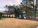 Community playground with slide, swings, climbing equipment, and ample space for to play and have fun outdoors at 9810 Foxworth Dr, Alpharetta, GA 30022