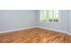 Bright bedroom with wood floors and a window at 1227 Ashford Creek Ne Park, Atlanta, GA 30319