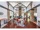 The common area offers a spacious seating arrangement, fireplace, and wooden beams at 1227 Ashford Creek Ne Park, Atlanta, GA 30319