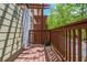 Cozy deck area with wood flooring and an outdoor privacy fence, perfect for relaxation at 1227 Ashford Creek Ne Park, Atlanta, GA 30319