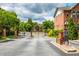 Gated community entrance with brick buildings and lush landscaping at 1227 Ashford Creek Ne Park, Atlanta, GA 30319