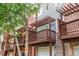 Townhome exterior features private balconies with wood railings and attached garages at 1227 Ashford Creek Ne Park, Atlanta, GA 30319