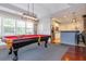 Game room features a pool table, bar seating, and a kitchenette at 1227 Ashford Creek Ne Park, Atlanta, GA 30319