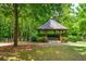Picturesque gazebo surrounded by lush greenery and trees, offering a serene outdoor space at 1227 Ashford Creek Ne Park, Atlanta, GA 30319