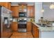 Updated kitchen with stainless steel appliances, wood cabinets, and granite countertops at 1227 Ashford Creek Ne Park, Atlanta, GA 30319