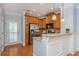 Modern kitchen with stainless steel appliances, granite counters, and wood cabinets at 1227 Ashford Creek Ne Park, Atlanta, GA 30319