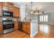 Stylish kitchen featuring wooden cabinets, stainless steel appliances, and an open design concept at 1227 Ashford Creek Ne Park, Atlanta, GA 30319