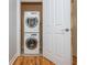 Convenient in-unit laundry featuring a stacked washer and dryer in a small closet at 1227 Ashford Creek Ne Park, Atlanta, GA 30319