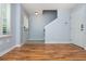 Bright living room with wood flooring, stairway, and neutral paint at 1227 Ashford Creek Ne Park, Atlanta, GA 30319