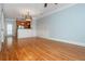 Open-concept living space with gleaming hardwood floors and access to the modern kitchen at 1227 Ashford Creek Ne Park, Atlanta, GA 30319