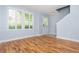 Spacious living room featuring wood floors, bright windows, and neutral paint at 1227 Ashford Creek Ne Park, Atlanta, GA 30319