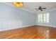 Bright living room featuring hardwood floors, white trim, and large windows at 1227 Ashford Creek Ne Park, Atlanta, GA 30319