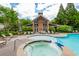 Community swimming pool and spa with lounge seating and a clubhouse in a landscaped setting at 1227 Ashford Creek Ne Park, Atlanta, GA 30319