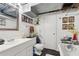 Bright bathroom with white vanity, tiled floors, tub, and decorative elements at 1241 Briarcliff Ne Rd, Atlanta, GA 30306