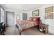 Cozy bedroom featuring a ceiling fan, built-in storage, artwork, and a well-made bed at 1241 Briarcliff Ne Rd, Atlanta, GA 30306