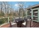 Open-air patio features four chairs, a stone table, and wooded views at 1241 Briarcliff Ne Rd, Atlanta, GA 30306