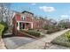 Charming two-story brick home with manicured landscaping and inviting front porch at 1241 Briarcliff Ne Rd, Atlanta, GA 30306