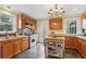 Spacious kitchen featuring wood cabinets, modern appliances, and stainless steel island at 1241 Briarcliff Ne Rd, Atlanta, GA 30306