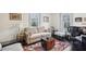 Cozy living room with hardwood floors, many windows, couch, chairs, and a decorative rug at 1241 Briarcliff Ne Rd, Atlanta, GA 30306