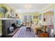 Inviting living room with a cozy fireplace, hardwood floors, and ample natural light at 1241 Briarcliff Ne Rd, Atlanta, GA 30306