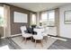 Dining room features modern table, chairs, and neutral decor for elegant meals at 135 Kingsley Way, Acworth, GA 30102