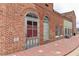 Charming brick building featuring a vintage door and window accents along a scenic walkway at 135 Kingsley Way, Acworth, GA 30102