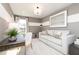 Brightly illuminated room with a desk, sofa, painting, neutral tones, and plush carpeting at 135 Kingsley Way, Acworth, GA 30102