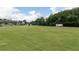 Expansive green field offering plenty of space for recreation and community events with trees at 135 Kingsley Way, Acworth, GA 30102