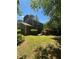 Spacious backyard featuring a wood deck and lush green lawn at 5250 Mountain Village Ct, Stone Mountain, GA 30083
