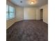 Spacious bedroom features plush carpet, closet, neutral paint and a window at 5250 Mountain Village Ct, Stone Mountain, GA 30083