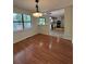 Open concept dining room leading to the kitchen with hardwood floors at 5250 Mountain Village Ct, Stone Mountain, GA 30083