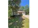 Charming two-story home with green siding, stone accents, and a well-maintained front yard at 5250 Mountain Village Ct, Stone Mountain, GA 30083