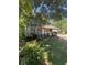 Charming two-story home with green siding, stone accents, and a well-maintained front yard at 5250 Mountain Village Ct, Stone Mountain, GA 30083