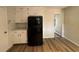 Functional kitchen with black appliances and white cabinets at 5250 Mountain Village Ct, Stone Mountain, GA 30083