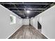 Spacious unfinished basement with structural ceiling, hardwood flooring, and ample space ready to be customized at 212 Lake Forest Dr, Acworth, GA 30102