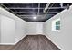 Finished basement offers modern flooring and great natural light from the window at 212 Lake Forest Dr, Acworth, GA 30102
