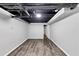 Spacious unfinished basement with structural ceiling, hardwood flooring, and ample space ready to be customized at 212 Lake Forest Dr, Acworth, GA 30102