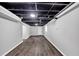 Finished basement features modern flooring, neutral walls, and an open ceiling at 212 Lake Forest Dr, Acworth, GA 30102
