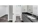 Well-lit bathroom with granite countertops, modern fixtures, and a walk-in closet for ample storage at 212 Lake Forest Dr, Acworth, GA 30102