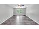 A large bedroom area, illuminated by a fan and natural light from the window at 212 Lake Forest Dr, Acworth, GA 30102
