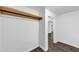 Bright walk-in closet with wood floors and a single shelf, offering basic storage at 212 Lake Forest Dr, Acworth, GA 30102