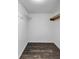 Compact closet with a wire rack and wood shelf for basic storage needs, featuring wood floors at 212 Lake Forest Dr, Acworth, GA 30102