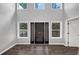 Spacious, airy foyer with soaring ceiling, lots of light and a modern front door at 212 Lake Forest Dr, Acworth, GA 30102