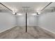 Spacious two car garage with concrete flooring and overhead lighting at 212 Lake Forest Dr, Acworth, GA 30102
